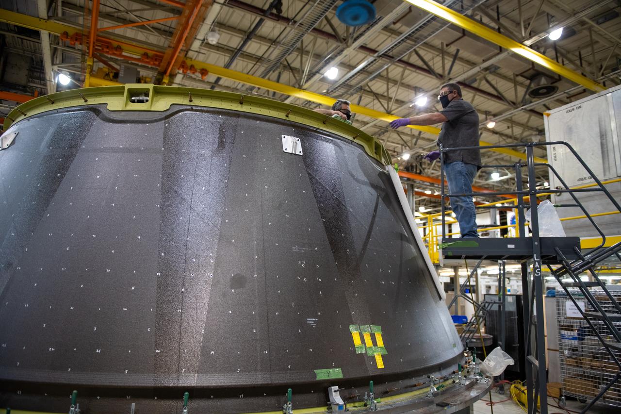 Employees wear personal protective gear at  Michoud Assembly Facility as the facility transitioned to Stage 3 of NASA’s Framework for Return To On-Site Work. Employees wear the appropriate personal protective equipment (PPE) and/or cloth face coverings as required for assigned tasks. Access to the facility is limited to authorized personnel working on mission-critical tasks that must be conducted onsite. Mission-critical tasks include slowly and methodically resuming Space Launch System (SLS) Core Stage and Orion production activities, particularly critical path deliverables to support the Artemis Program, at a pace that limits personnel and follows federal guidelines for social distancing and use of personal protective equipment such as face masks. For more information about SLS, visit nasa.gov/sls.